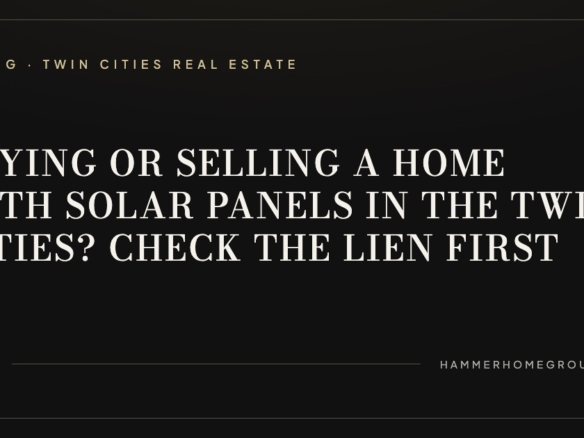 Rooftop solar panels on a two-story Twin Cities home under a clear blue sky