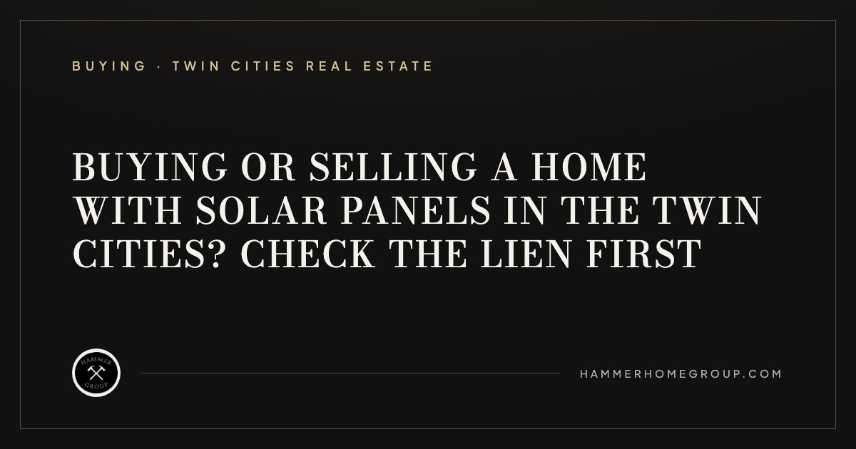 Rooftop solar panels on a two-story Twin Cities home under a clear blue sky