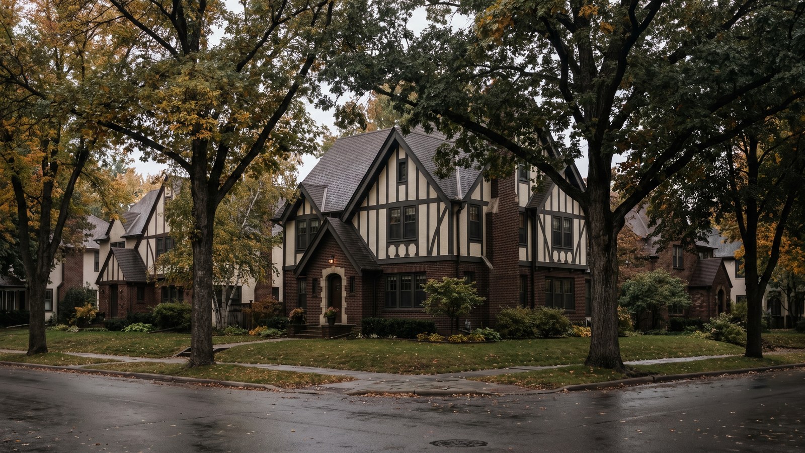 Century-old Tudor-style home exterior in a Twin Cities neighborhood, representing older houses subject to lead paint disclosure Minnesota rules due to pre-1978 construction